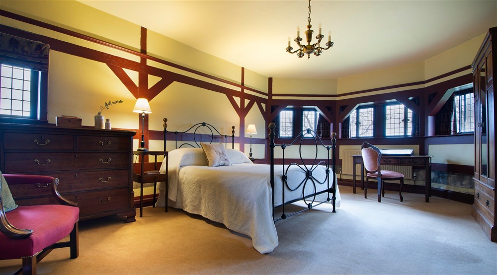 The biggest bedroom on the first floor of Choristers House has a double bed, en-suit bathroom and bay windows overlooking the Studley Royal Deer Park, Yorkshire at Choristers' House in Nr Ripon, North Yorkshire