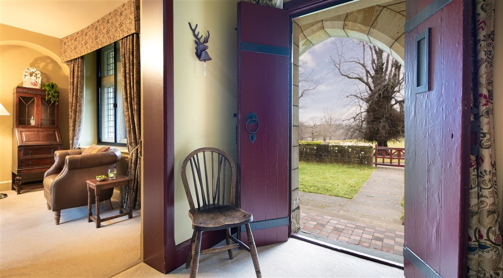 The hallway with door to the enclosed garden at Choristers' House in Nr Ripon, North Yorkshire