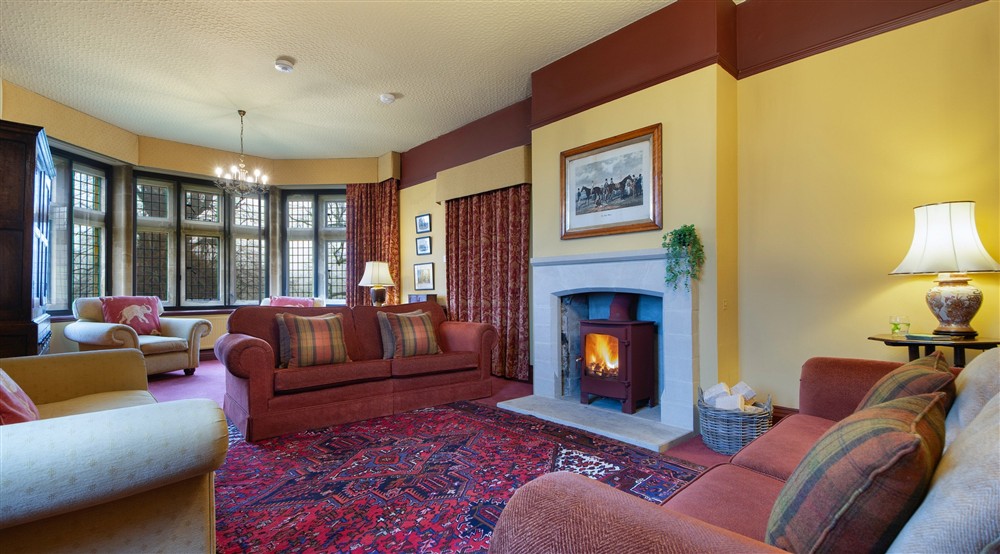 The large and comfortable formal sitting room, with log burner at Choristers' House in Nr Ripon, North Yorkshire