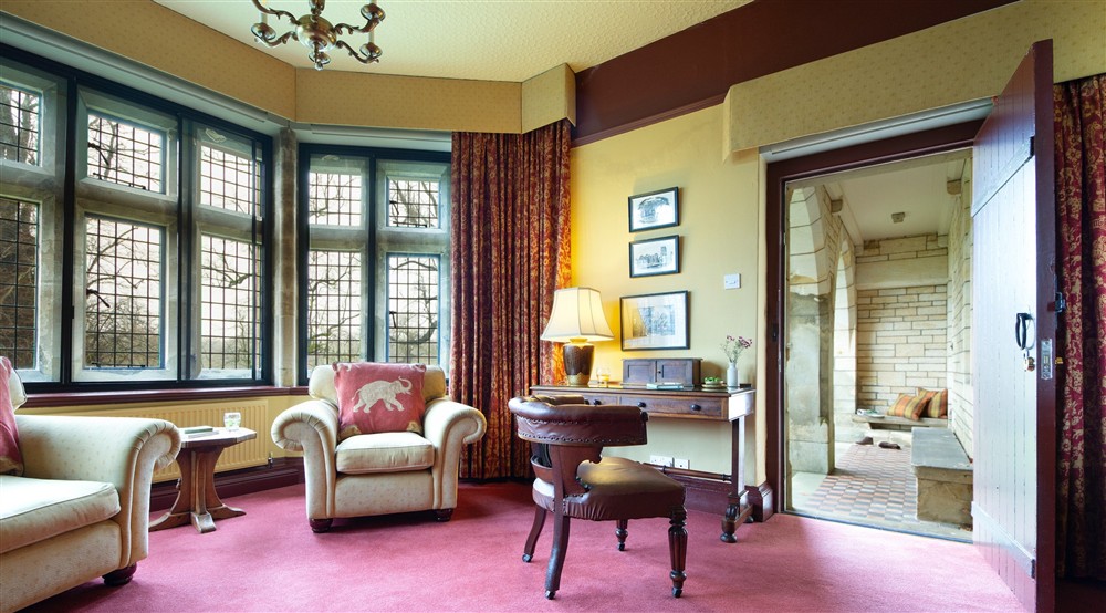 The seating area in the large bay window of the formal sitting room has wide views across Studley Royal Deer Park at Choristers' House in Nr Ripon, North Yorkshire