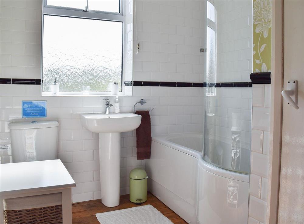 Lovely bathroom with shower over the bath at Chorlton Moss Cottage in Baldwins Gate, near Newcastle-under-Lyme, Staffordshire