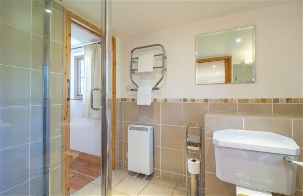 Bathroom with a bath, separate shower cubicle, wash basin and WC at Church Close Cottage, Cusgarne, Truro 