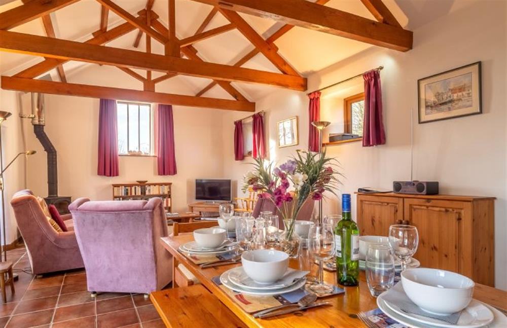 Dining area with table and seating for six at Church Close Cottage, Cusgarne, Truro 