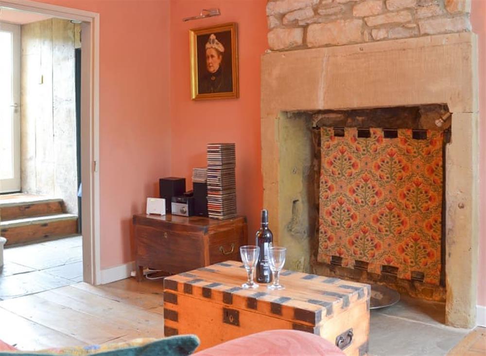 Living room with charming fire screen at Church Cottage in Bakewell, Derbyshire