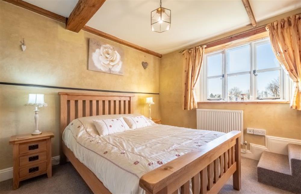 First floor: Bedroom two with double bed at Church Cottage, Castle Acre near Kings Lynn