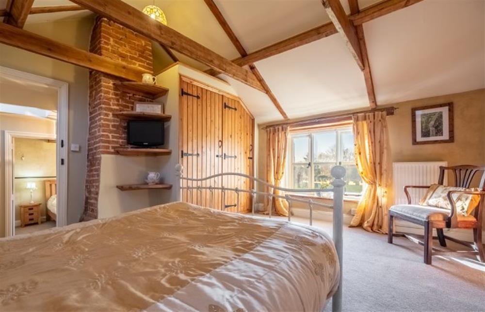 First floor: Master bedroom with double bed at Church Cottage, Castle Acre near Kings Lynn