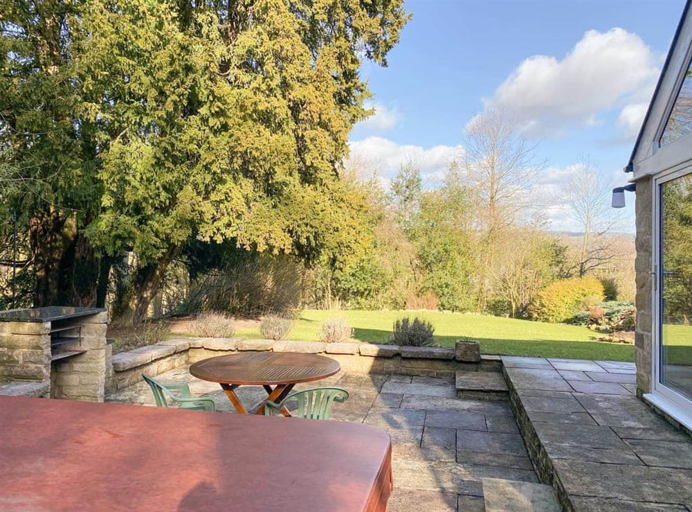 Outdoor area with hot tub at Church Cottage in Darley Bridge, near Matlock, Derbyshire
