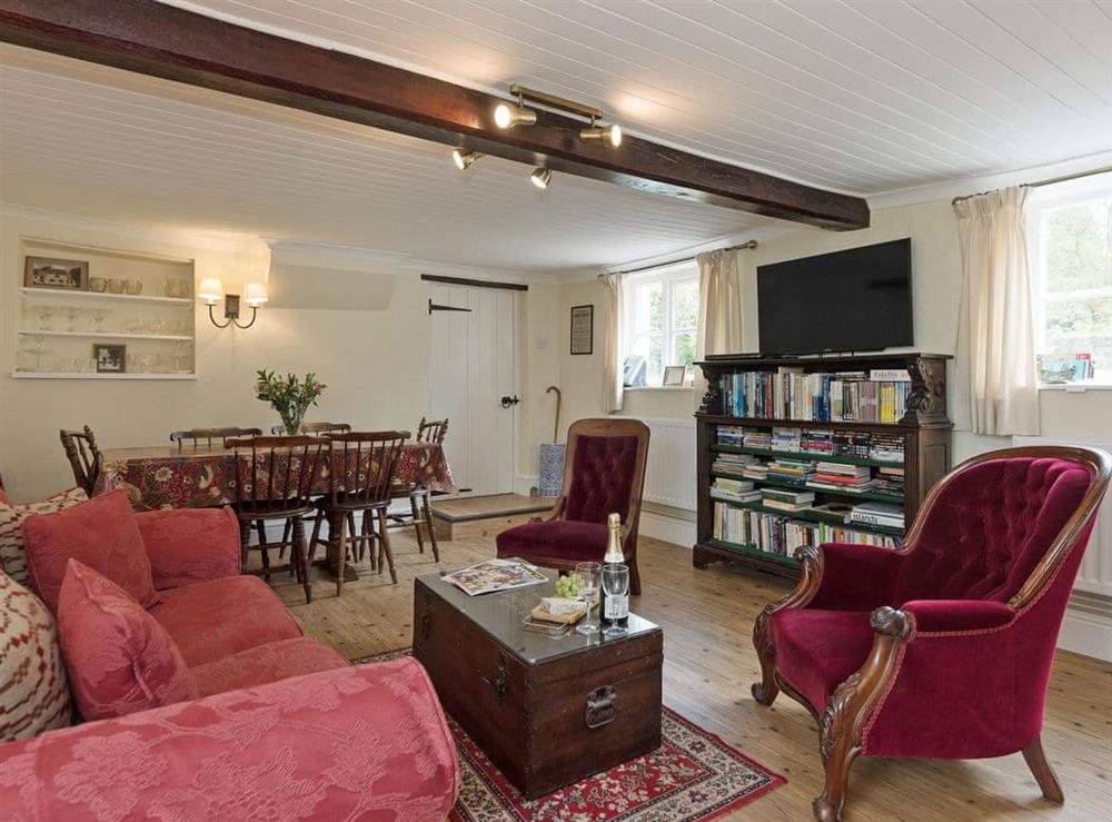 Charmingly furnished living/dining room (photo 2) at Church Cottage in Denford, near Thrapston, Northamptonshire