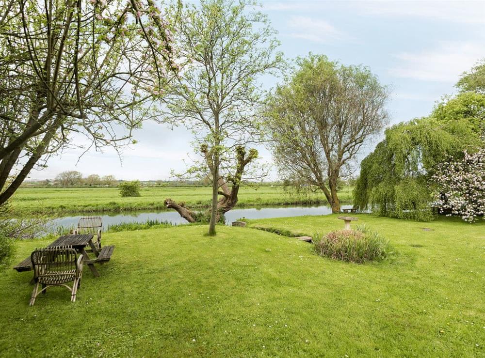Impressive garden overlooking the River Nene at Church Cottage in Denford, near Thrapston, Northamptonshire
