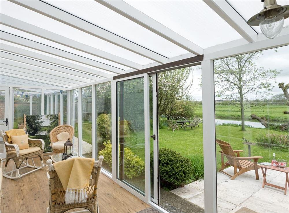 Light and airy garden room at Church Cottage in Denford, near Thrapston, Northamptonshire