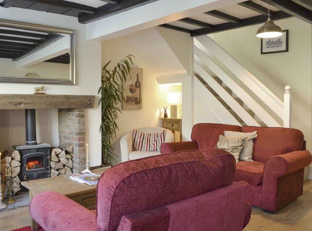 Characterful living area with wood burner at Church Court Cottage in Beeford, near Driffield, North Humberside