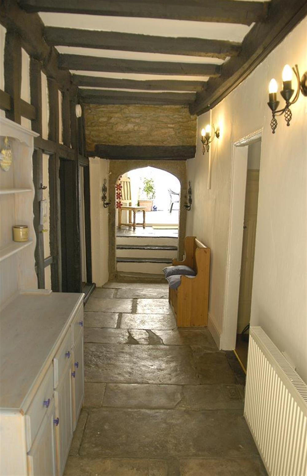 The entrance hallway looking through to the rear courtyard at Church House, Looe
