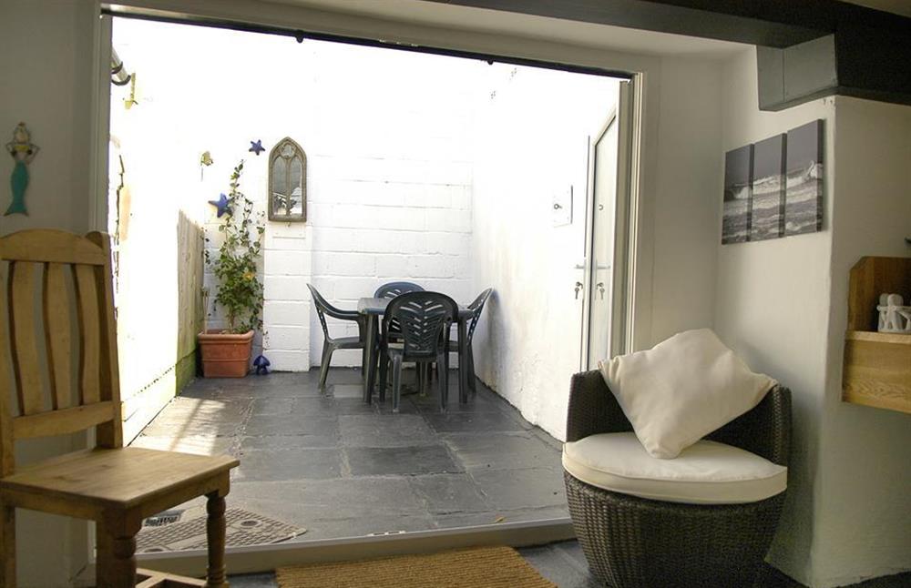The garden room looking out to the courtyard at Church House, Looe