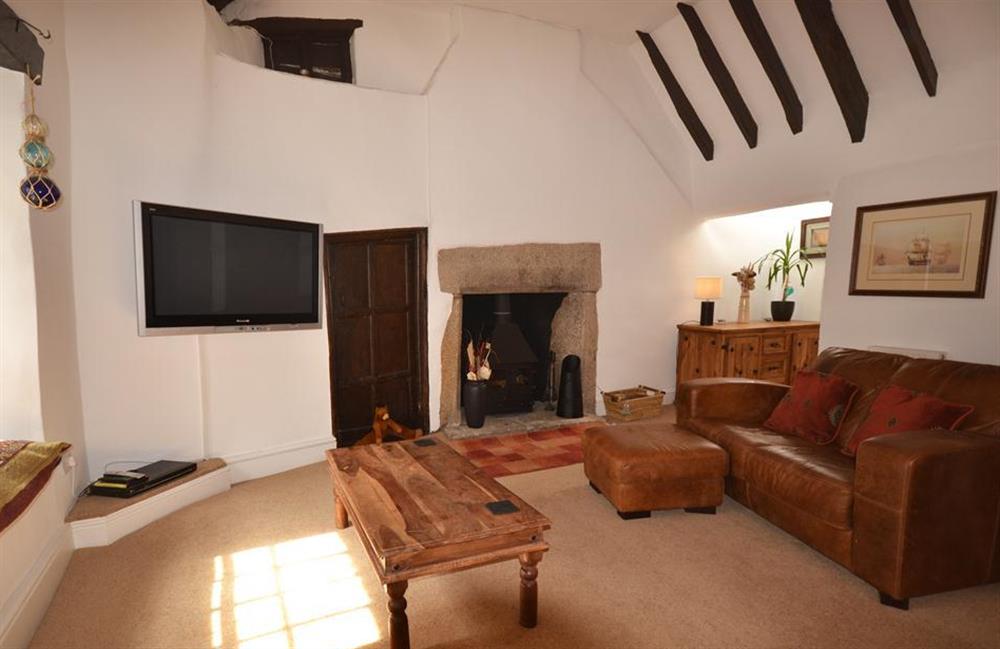 The spacious living room and woodburner at the Church House at Church House, Looe