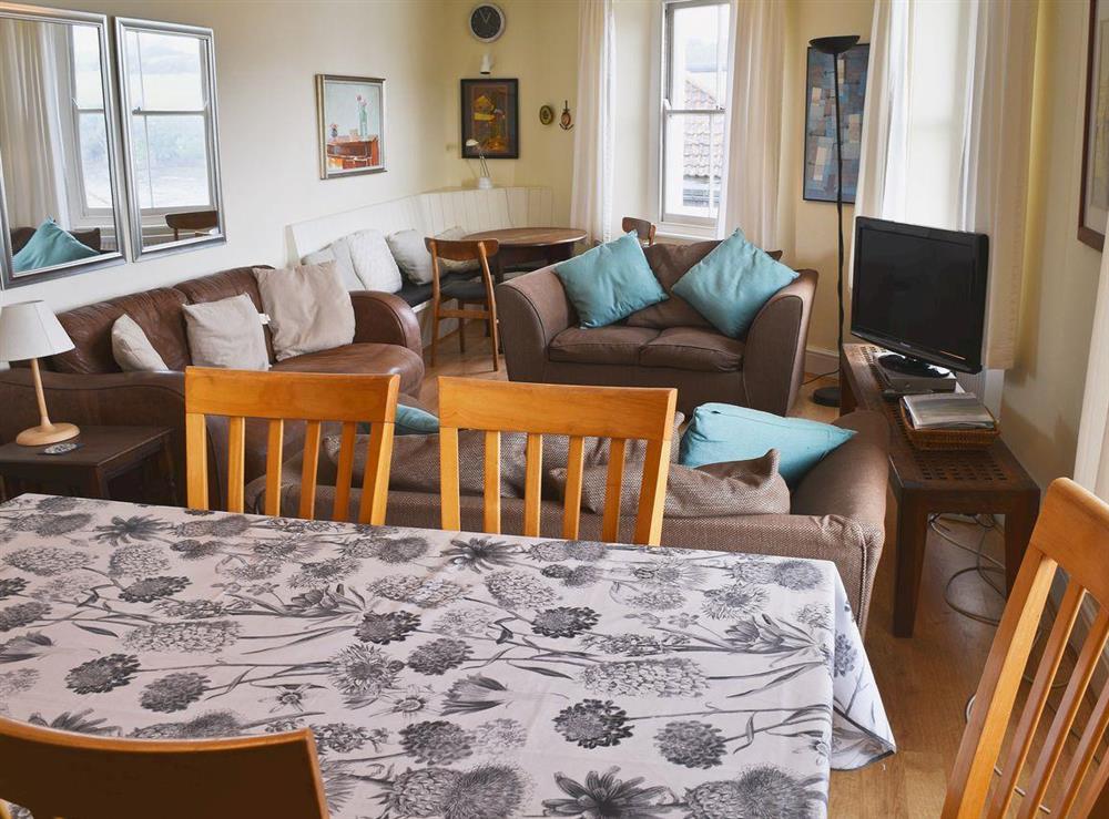 Sitting and dining room at Church St 1, Upper Apartment in Salcombe, Devon