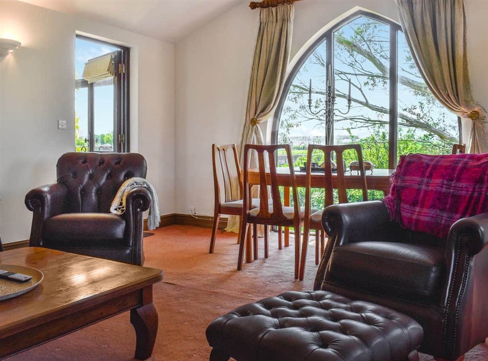 Open plan living space at Church View Apartment in Parkham, near Bideford, Devon