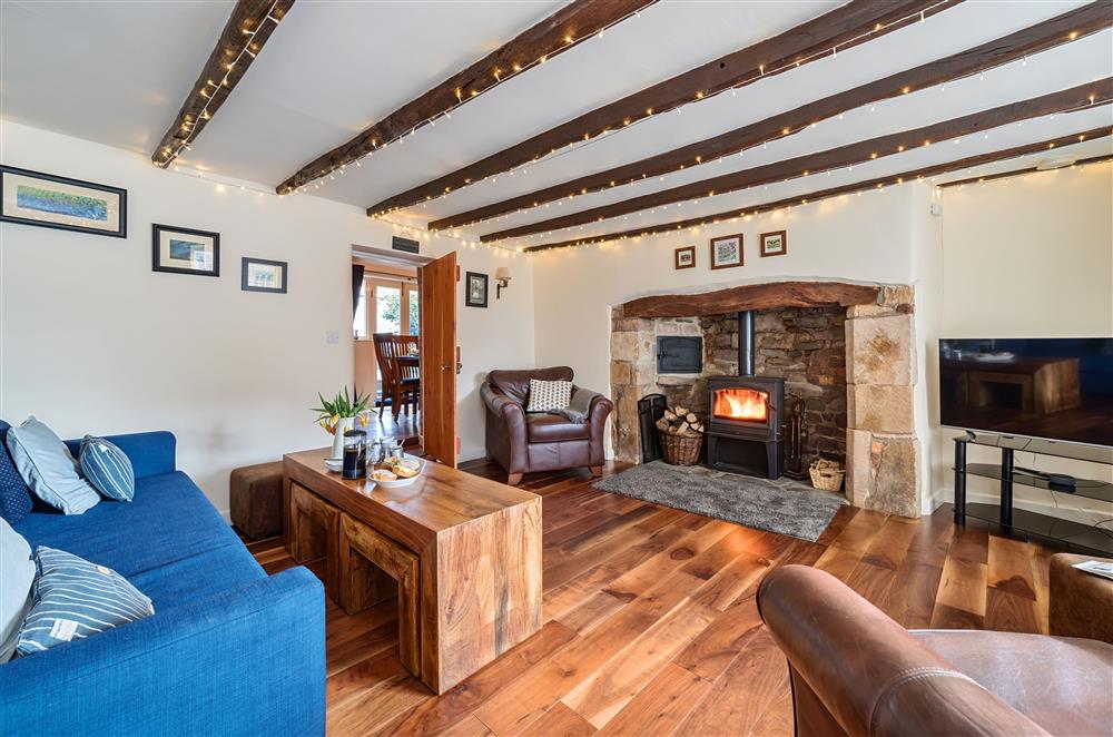 The inglenook fireplace and original beams add character and charm