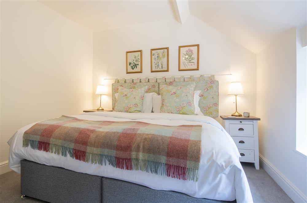Bedroom two with a 6’ super-king size zip and link bed at Church View, Nunnington