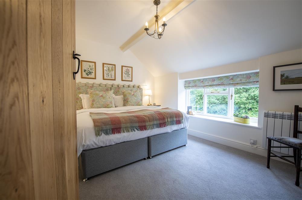 Bedroom two with a 6’ super-king zip and link bed at Church View, Nunnington