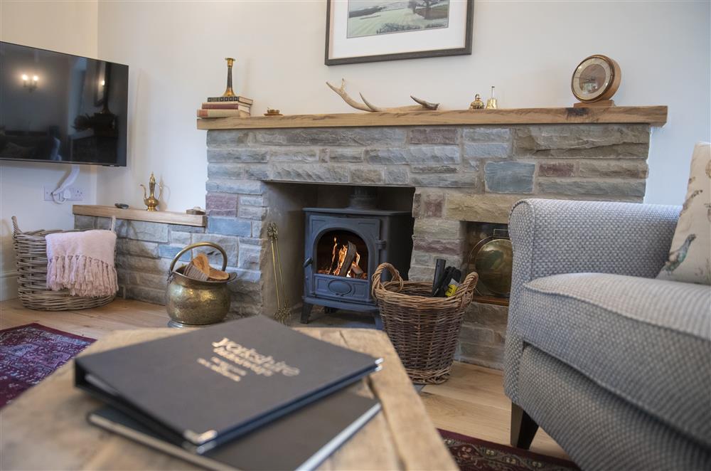 The wood burning stove fills the room with warmth over the winter months