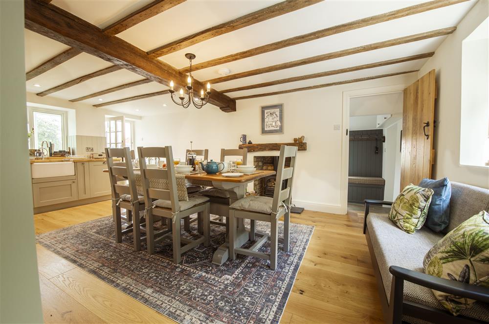 Well-equipped kitchen and dining area with a wood burning stove at Church View, Nunnington