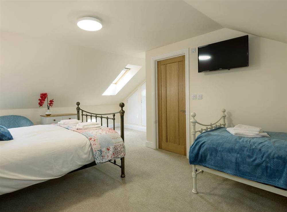 Comfortable bedroom with kingsize bed and twin beds (photo 2) at Church View in Wainfleet St. Mary, near Skegness, Lincolnshire