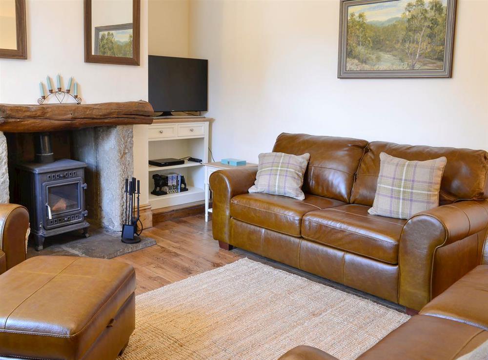 Cosy and warm living room with wood burner at Churchill House in Grassington, North Yorkshire