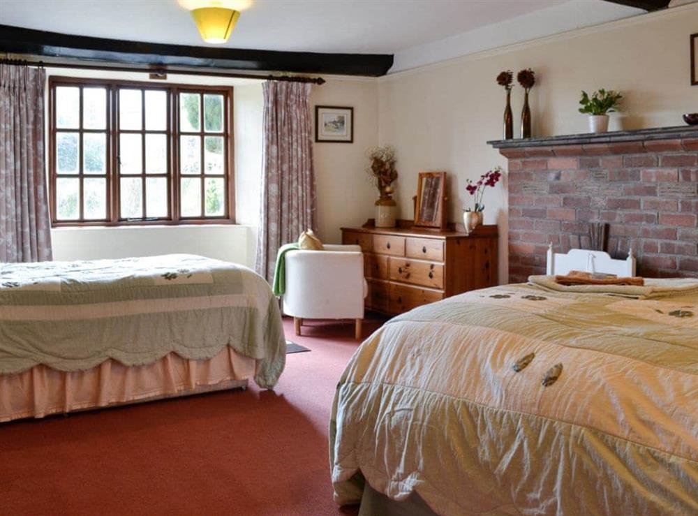 Twin bedroom at Churchtown Farm Cottage in West Anstey, Devon