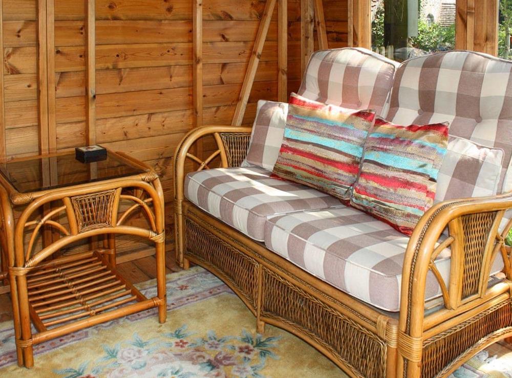Comfy seating within the summerhouse at Churchview House in Winterbourne Abbas, near Dorchester, Dorset