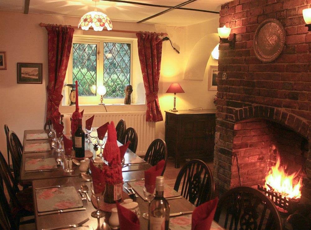 Dining Room with open fire at Churchview House in Winterbourne Abbas, near Dorchester, Dorset