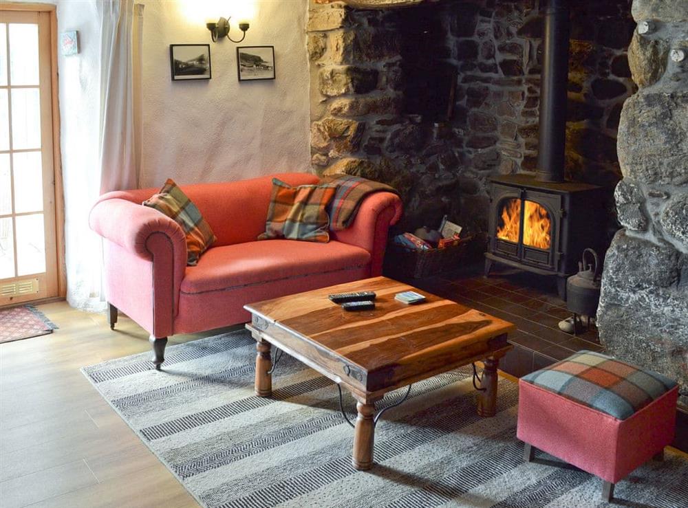 Cosy living room with wood burner at Chy-An-Ky-Bras in Porthallow, near St Keverne, Cornwall