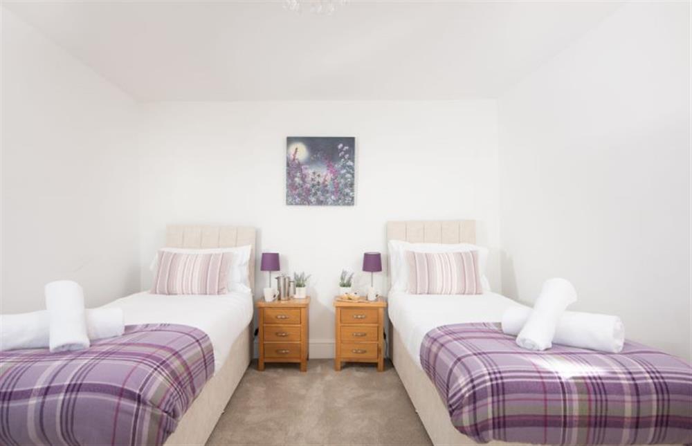 Bedroom four with twin single beds that can be converted to a king size bed on request at Chy an Mor, Coverack