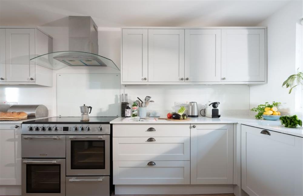 Kitchen with a double electric range cooker, microwave, fridge/freezer, coffee machine, dishwasher, and washing machine (photo 2)