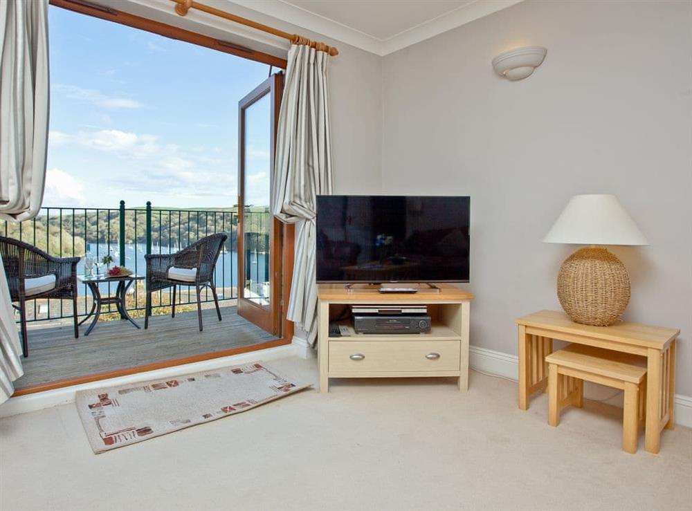 Light and airy living room with access to a balcony at Chyandour in Fowey, Cornwall
