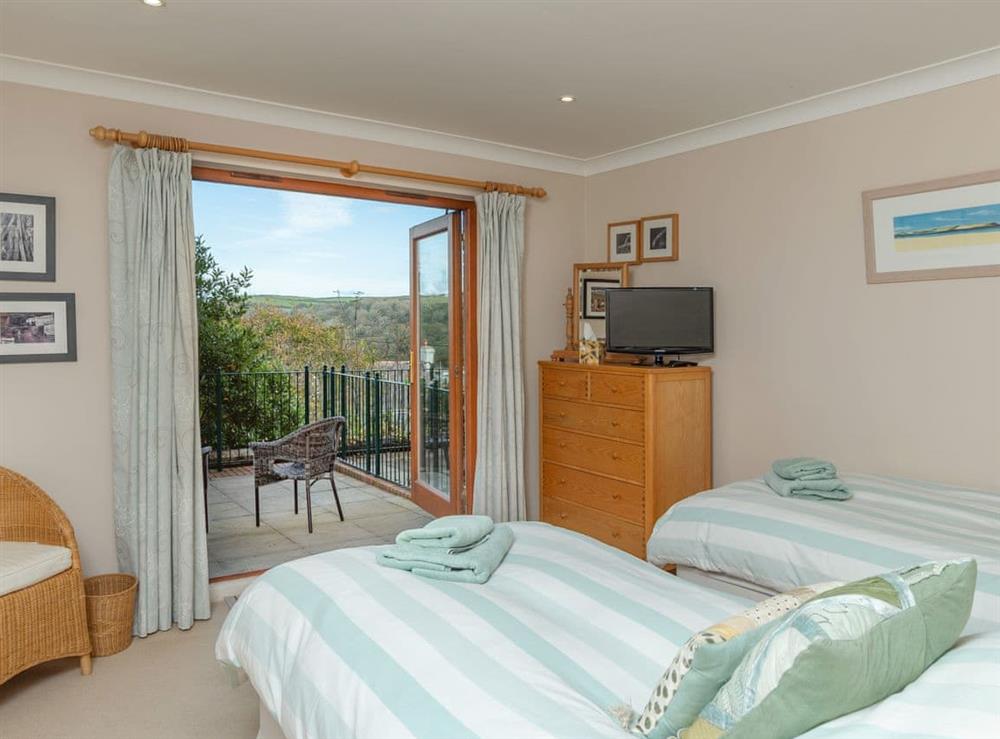 Twin bedroom with balcoy at Chyandour in Fowey, Cornwall