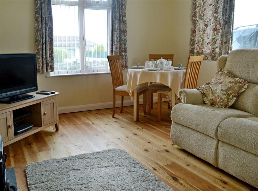 Homely living/dining room at Chycot in Widemouth Bay, near Bude, Cornwall