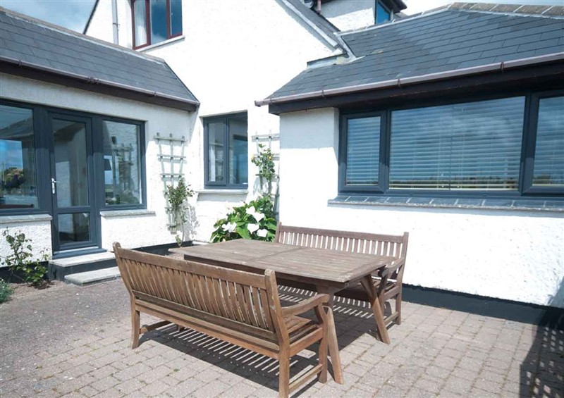 Enjoy a glass of wine on the patio at Chynoweth, Crantock