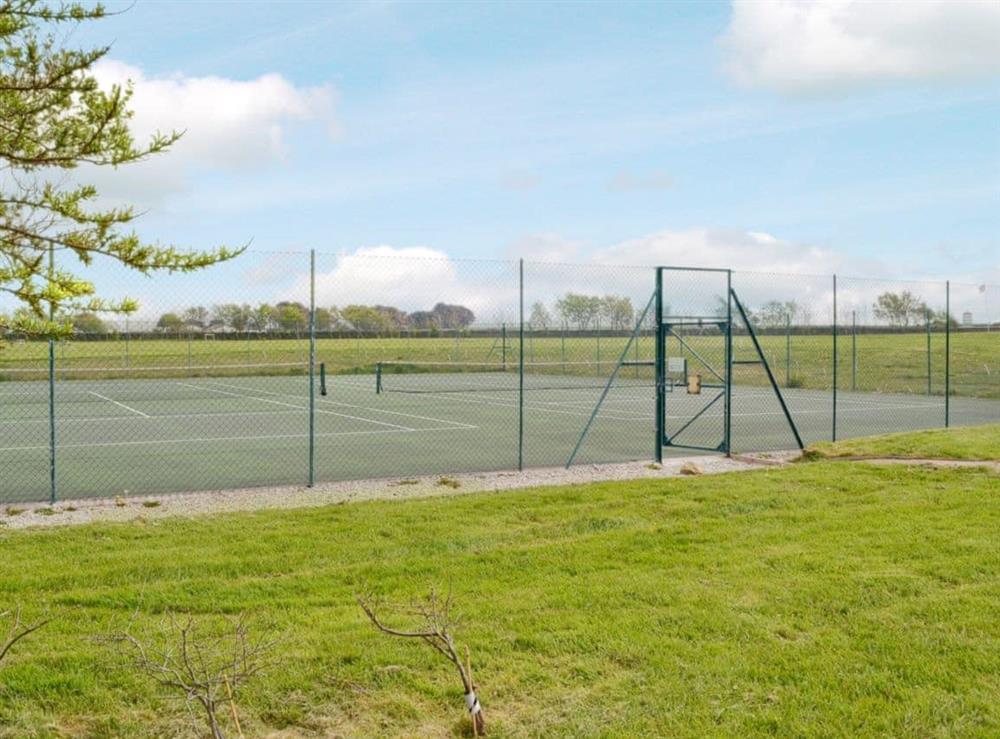 Tennis court at Chynoweth in St Merryn, near Padstow, Cornwall