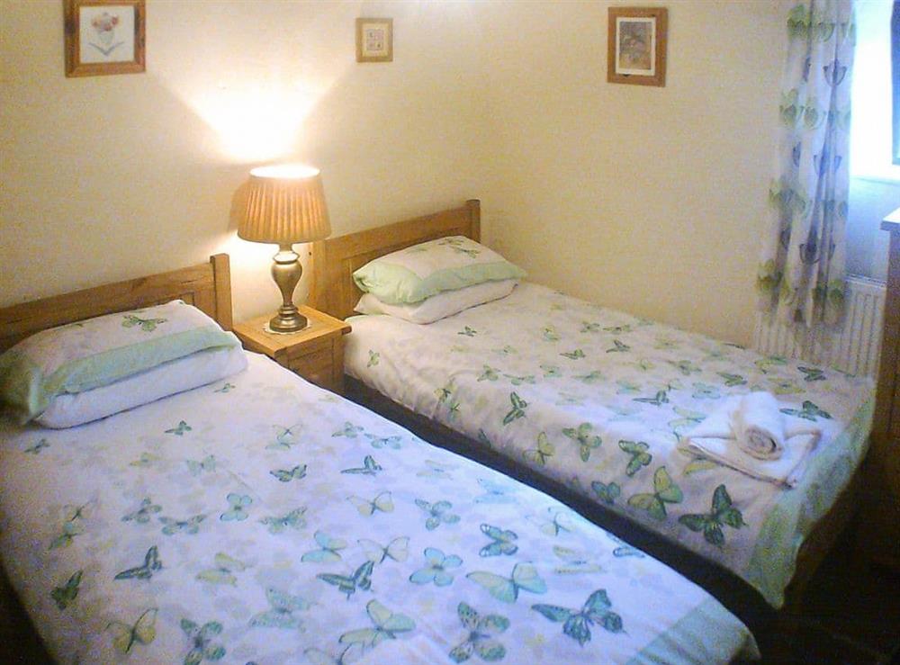 Downstairs twin bedroom at Cider Cottage in Hawkchurch, Nr Lyme Regis., Devon