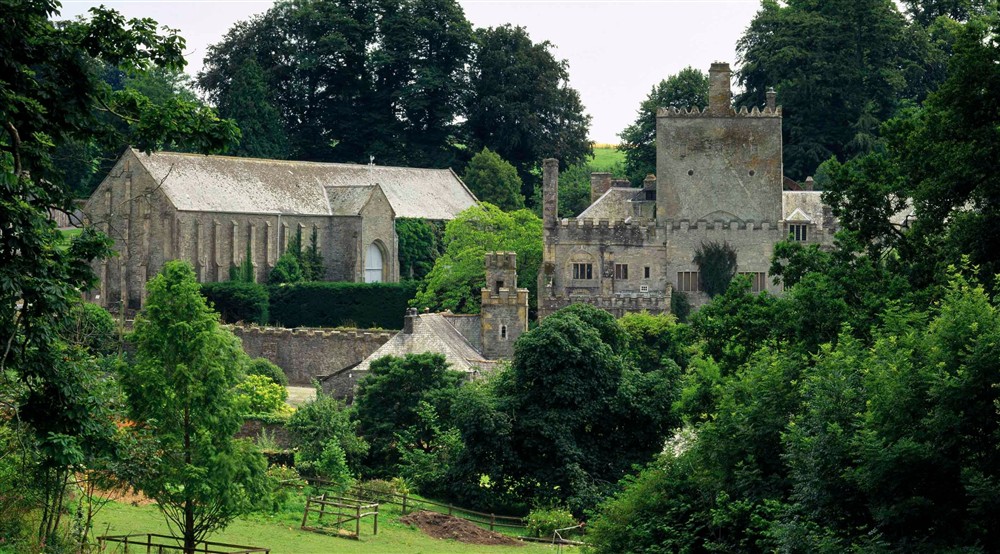 A panoramic view of Buckland Abbey seen from the north. The Great Barn stands out prominently to the left. at Cider Cottage in Yelverton, Devon