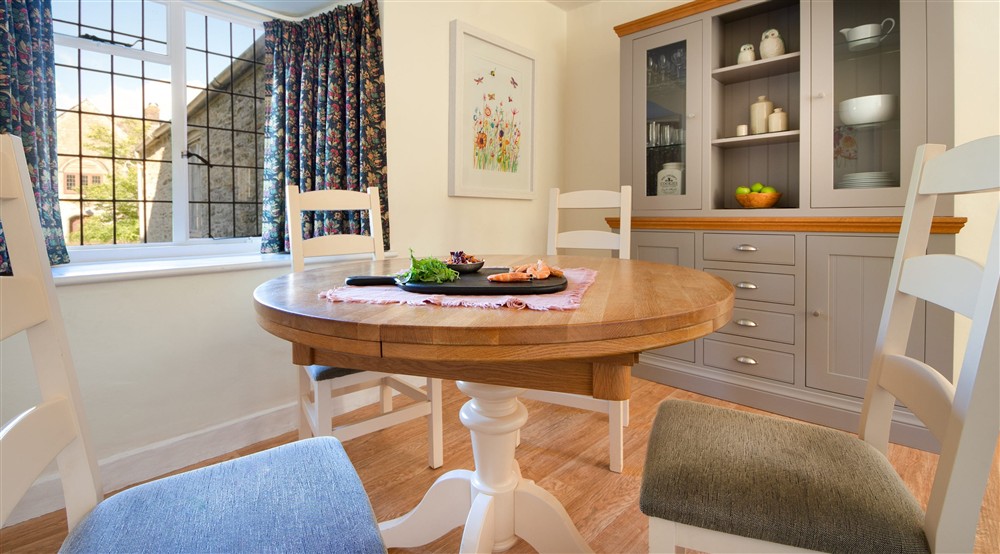 The dining area in the open-plan kitchen and dining room at Cider Cottage in Yelverton, Devon