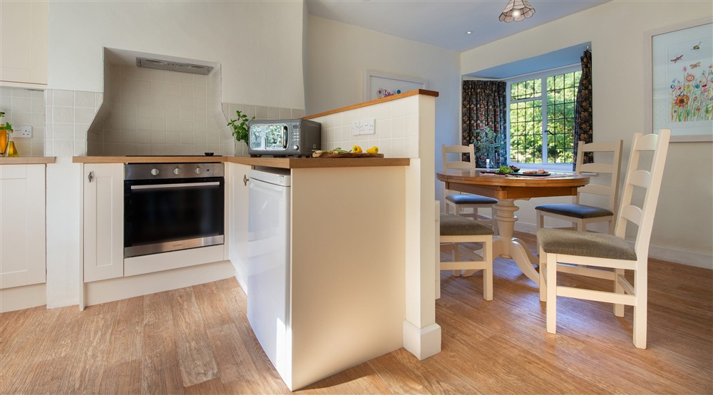 The open-plan kitchen and dining room at Cider Cottage in Yelverton, Devon