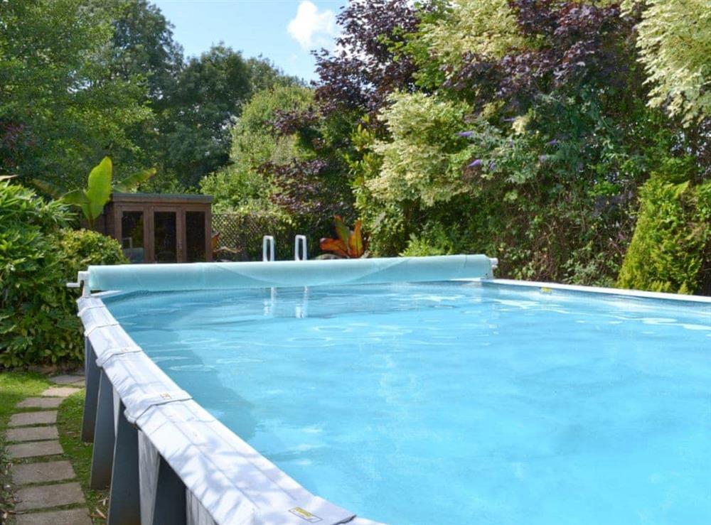 Shared heated open-air swimming pool at Cider House in Polson, Launceston, Cornwall