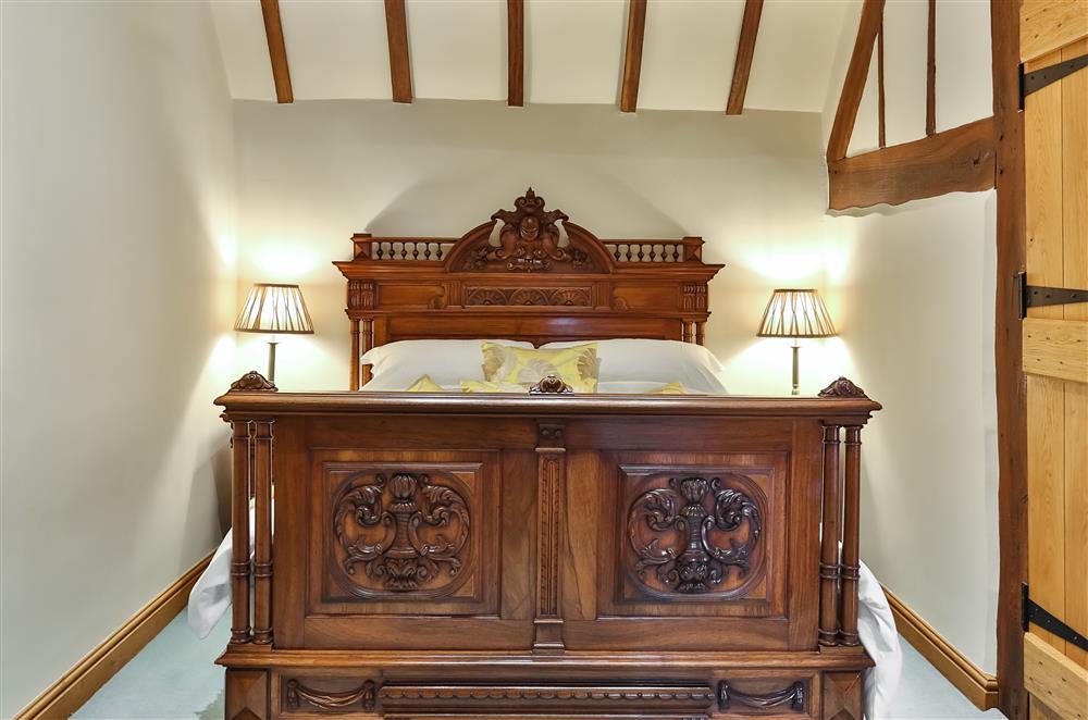 The beautiful, French antique double bed at Cider Mill Cottage, Clifton upon Teme