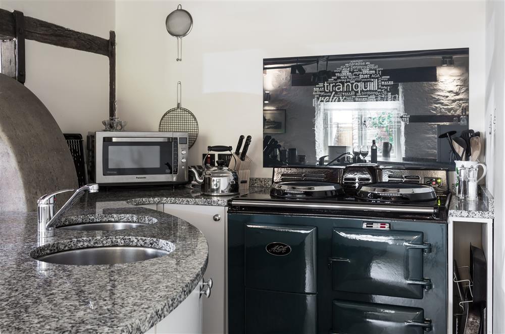 The kitchen boasts a traditional Aga at Cider Mill Cottage, Clifton upon Teme