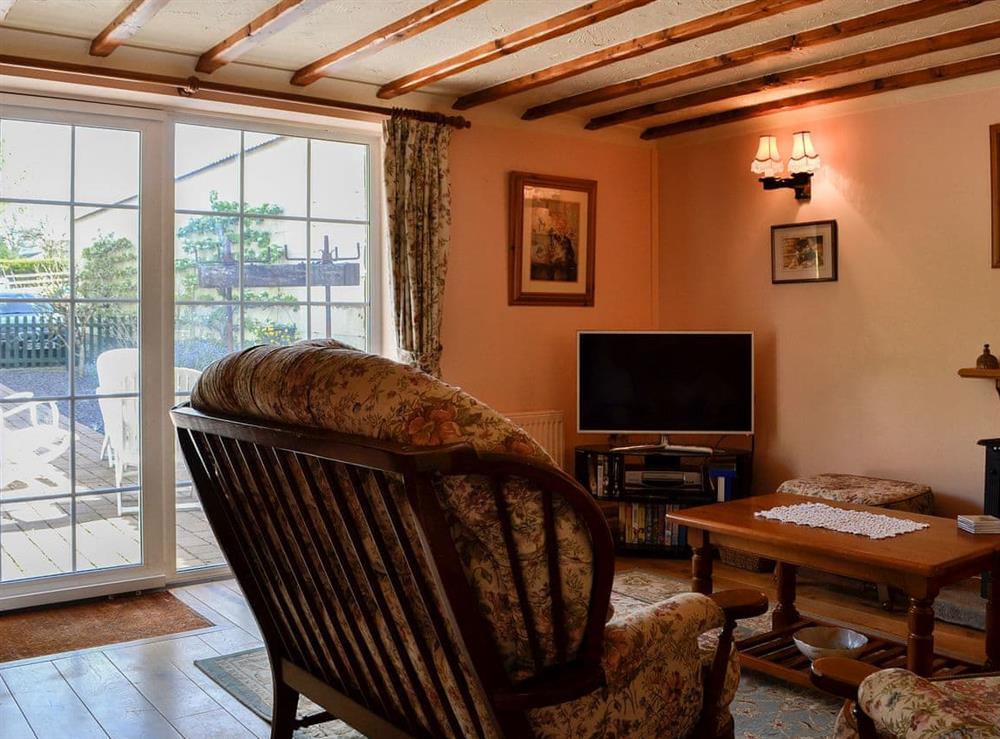 Living area at Cider Press Cottage in Blakeney, Gloucestershire