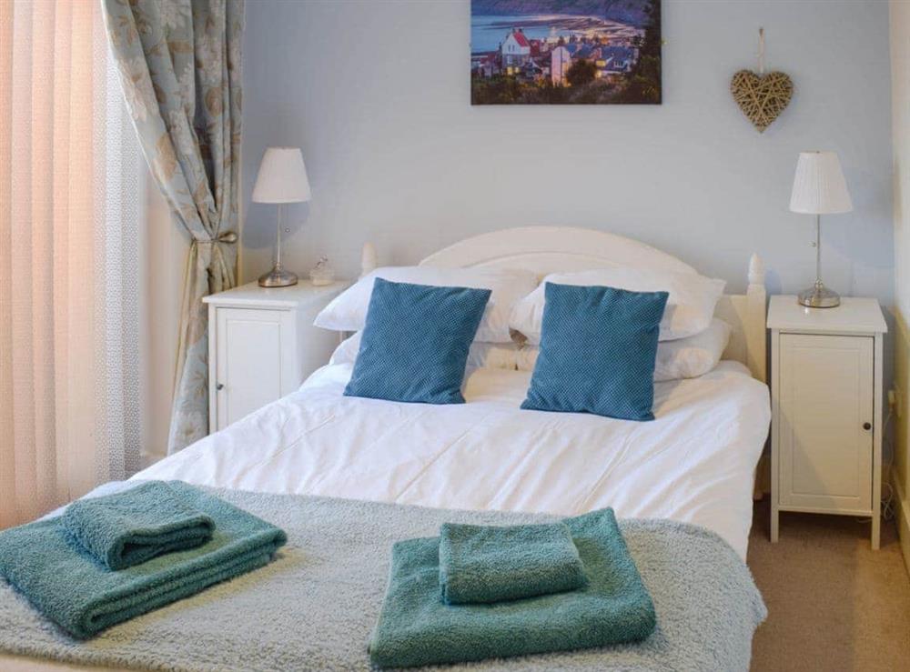 Comfortable double bedroom with it’s own balcony at Cinder Warren in Whitby, North Yorkshire