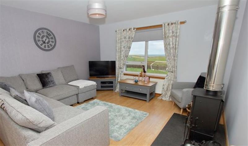 Enjoy the living room at Clachan Sands Cottage, Lochmaddy