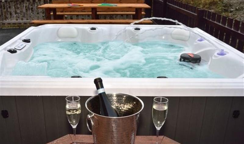 Relax in the hot tub at Clachan Sands Cottage, Lochmaddy
