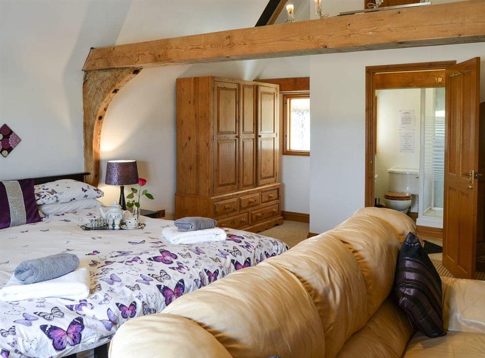 Double bedroom with seating area & en-suite (photo 2) at Clamp Farm Barn in Creeting St Peter, near Stowmarket, Suffolk